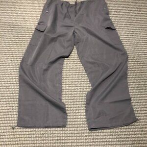 Extremely baggy grey parachute pants with adjustable waist